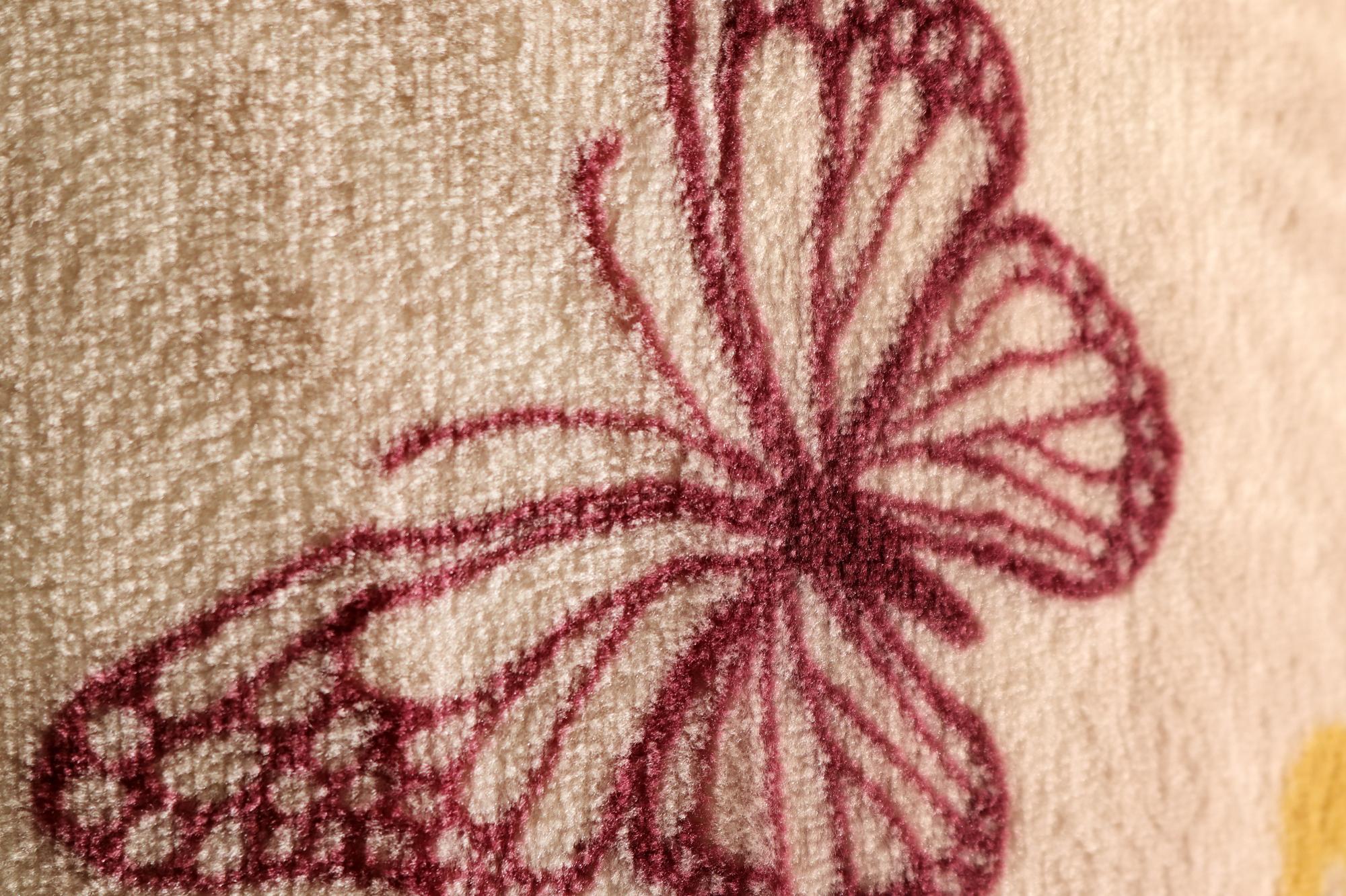 Close-up of hand-stitched floral motif